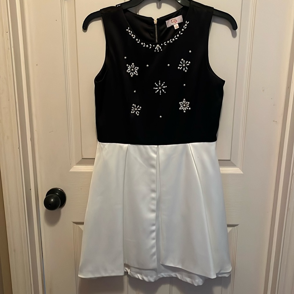 Black and off-white sleeveless formal dress with jewels